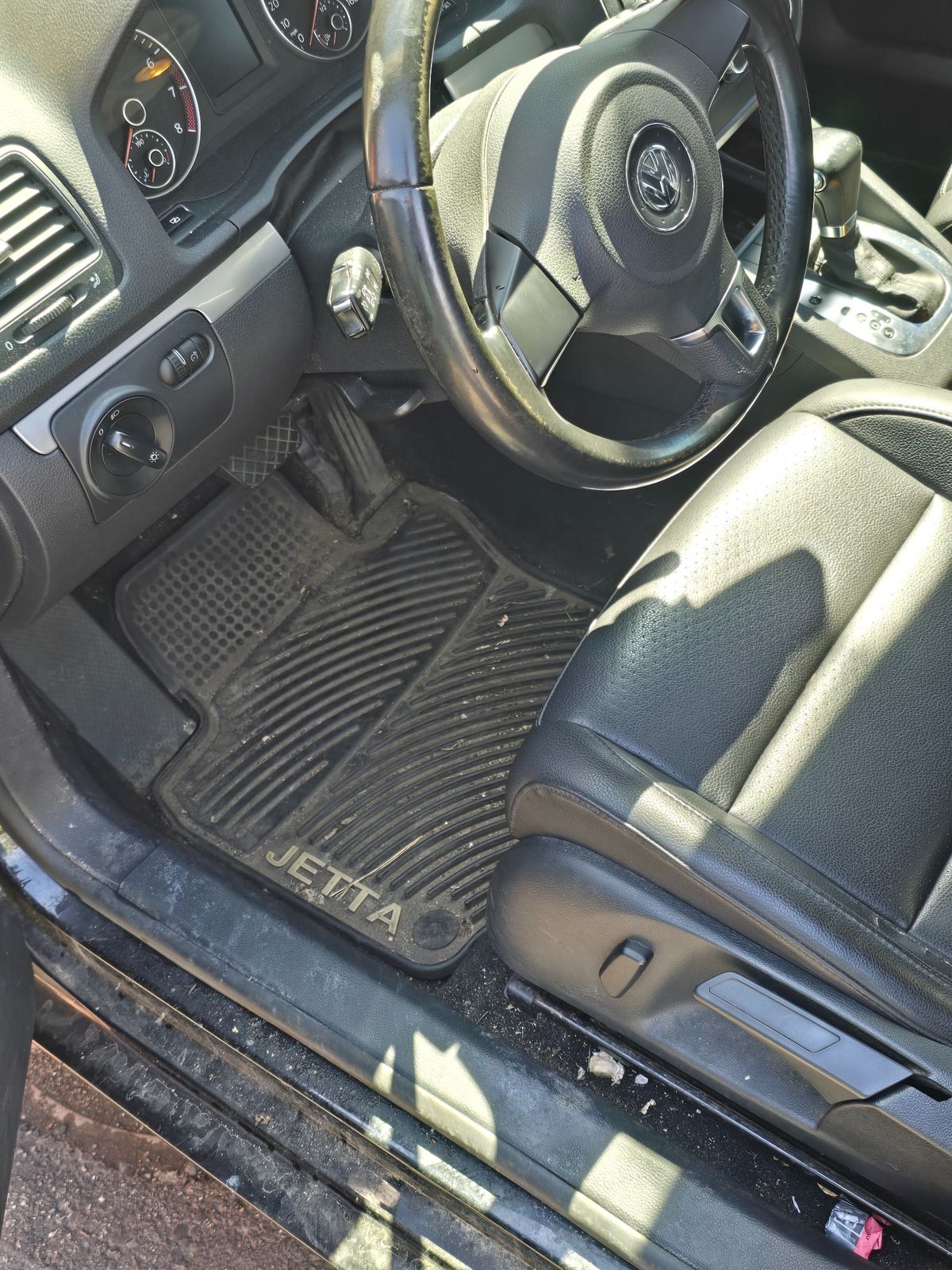 Volkswagen Jetta interior before mobile detailing in Hudson WI