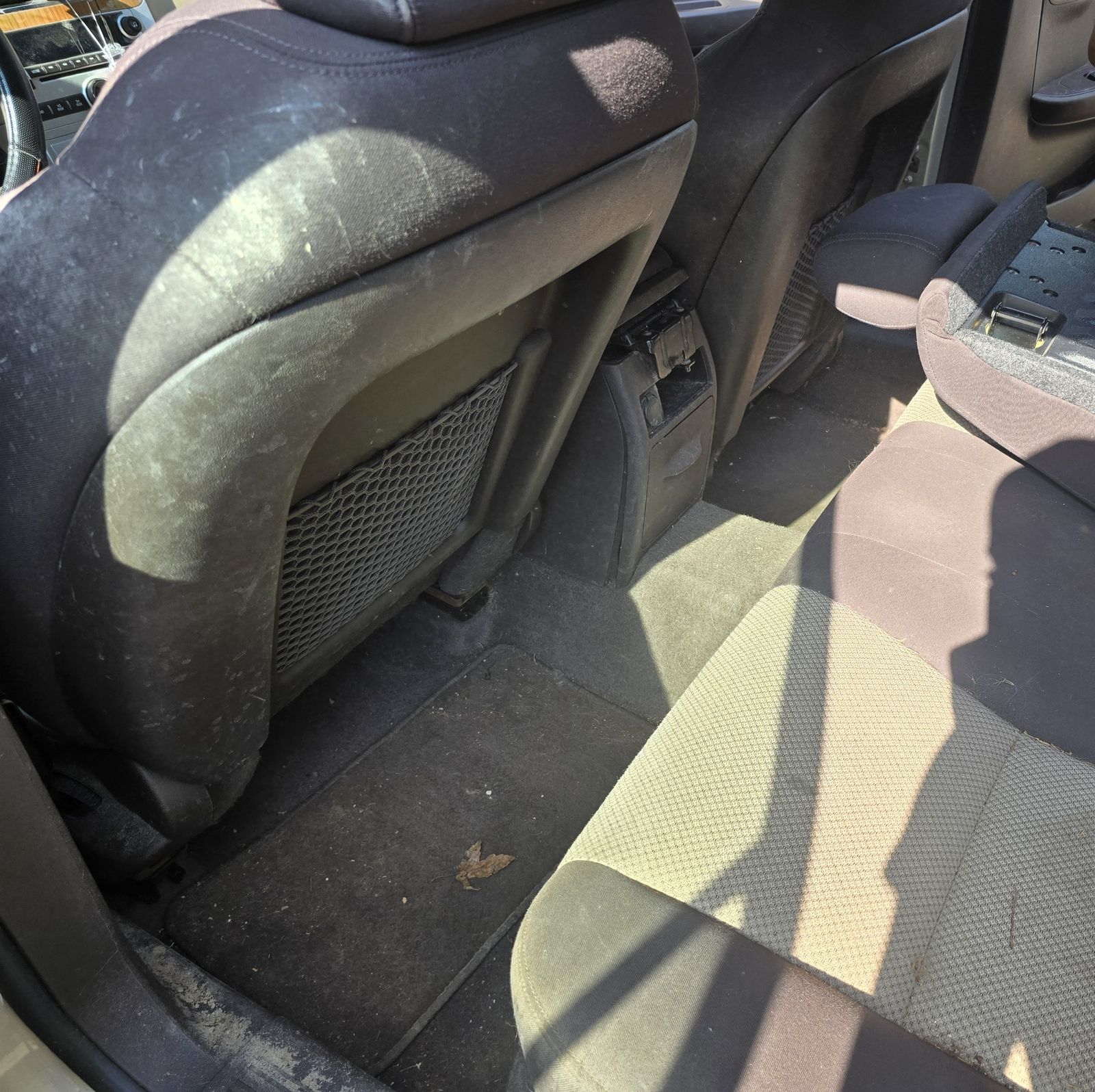 Vehicle rear floor before interior detailing